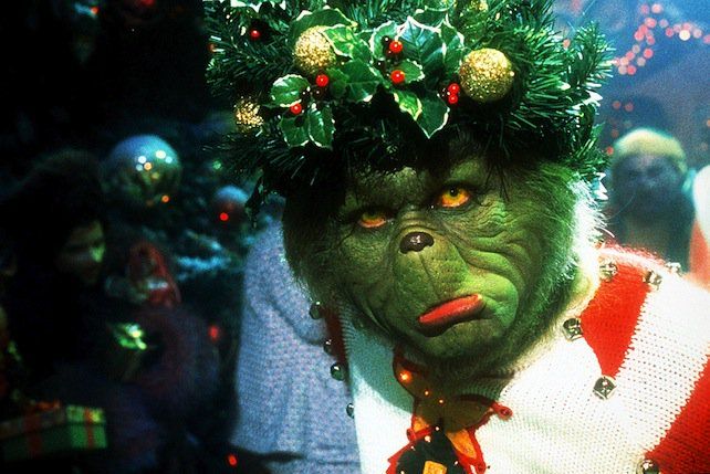 The Grinch wearing a tinsel holly crown